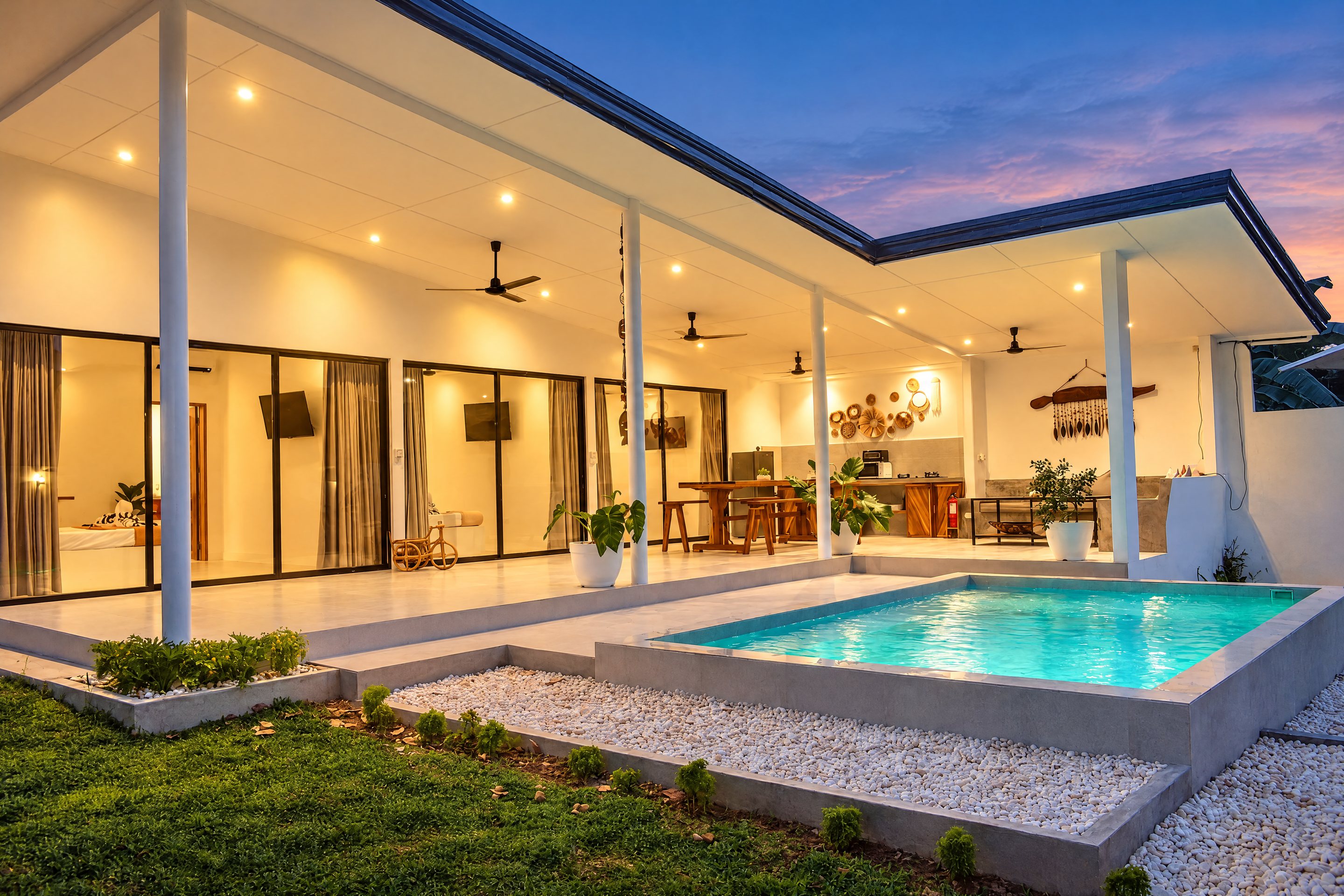 White House Villa and its illuminated pool at dusk